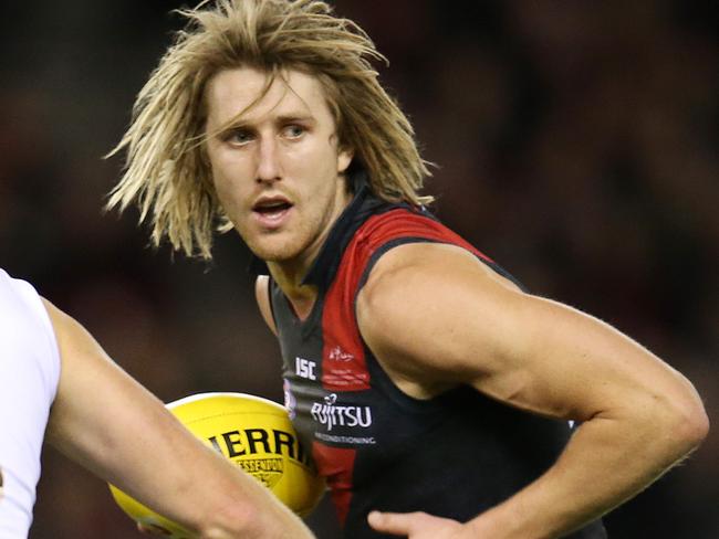 AFL Round 21. 10/08/2018.  Essendon v St Kilda at Etihad Stadium.  Essendon's Dyson Heppell  steps inside St Kilda's Sebastian Ross   .Pic: Michael Klein