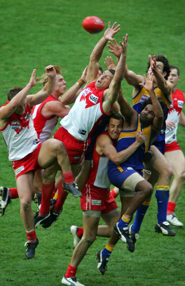 2005: Sydney led by four points in the dying seconds of the Grand Final when leaping Leo Barry flew across a pack and pulled in one of the AFL’s most memorable game-saving marks. Picture: Craig Borrow