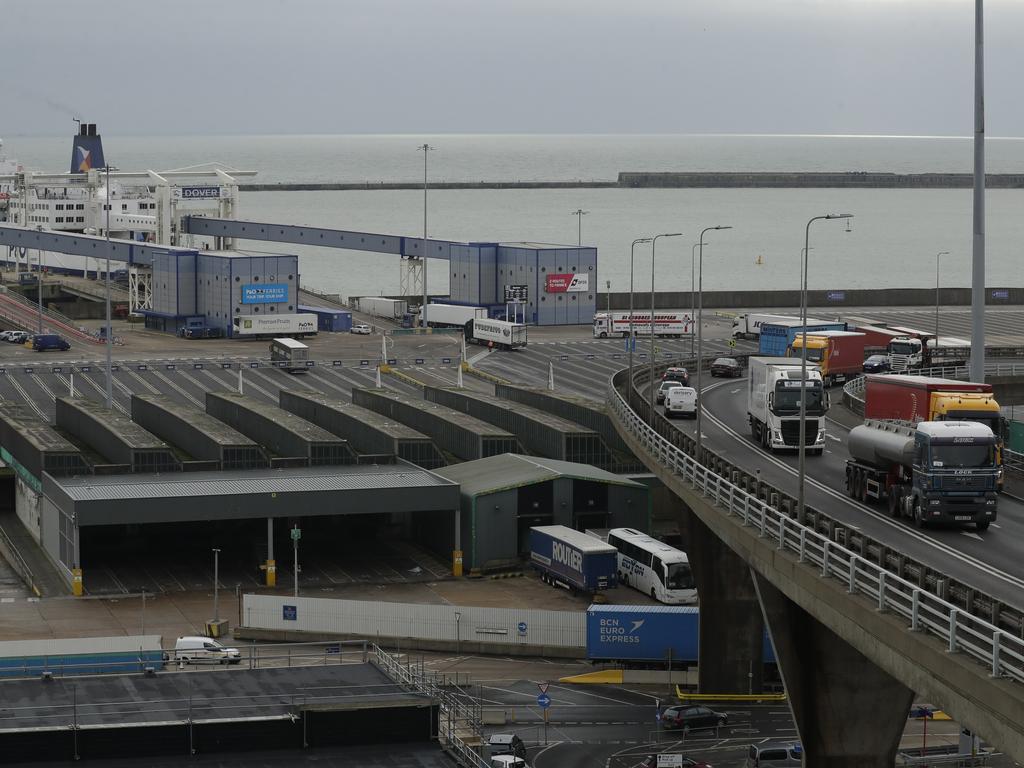 Trucks, at right, take part in a no-deal Brexit test, by driving through Dover near the ferry port. Britain is testing how its motorway and ferry system would handle a no-deal Brexit. Picture: AP/Matt Dunham