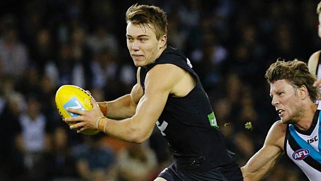 Patrick Cripps runs away from Port Adelaide's Brad Ebert. Picture: George Salpigtidis