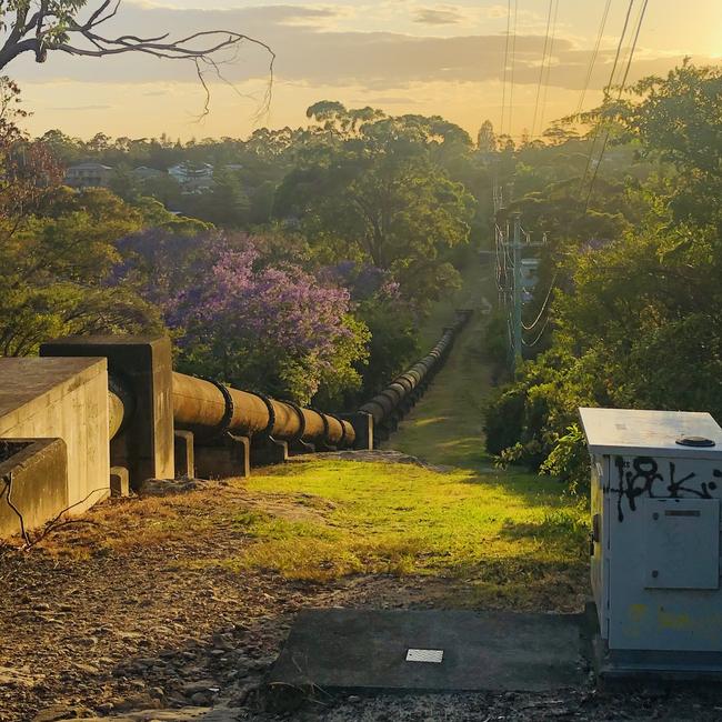 A section of the Sydney Water pipeline, siting on its concrete “saddles”near Ethie Rd, at Beacon Hill. Picture: Jim O'Rourke