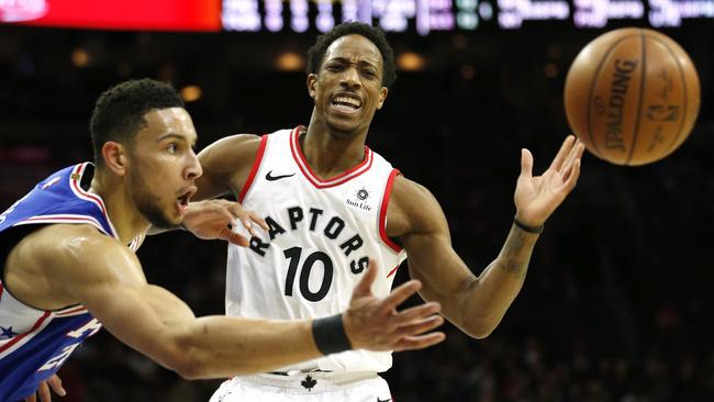 Philadelphia 76ers guard Ben Simmons, left, gets the ball away from Toronto Raptors guard DeMar DeRozan. Picture: AP