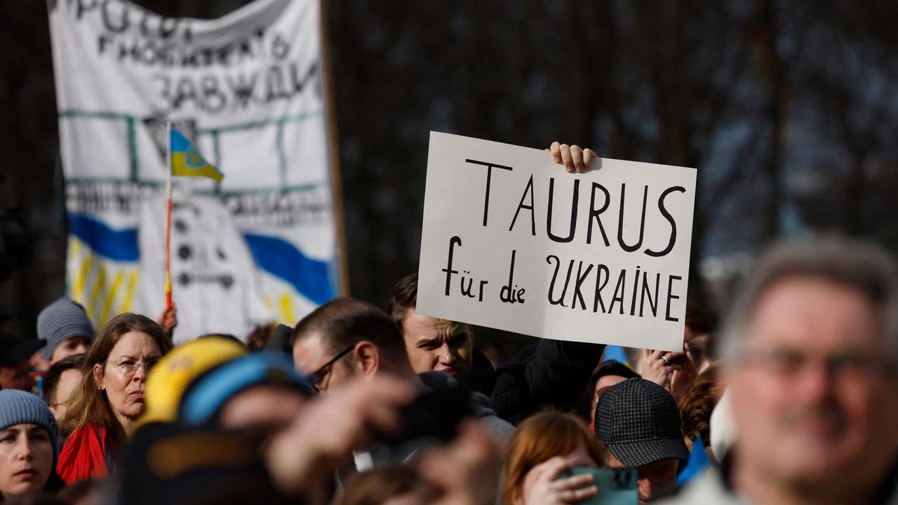 A demonstrator holds up a placard calling on the German government to supply Ukraine with Taurus air-to-surface cruise missiles, during a rally in support of Ukraine. Picture: AFP