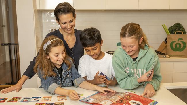 Sydney mum-of-three Andrea Burmeister is looking forward to collecting Woolworths’ new Disney 100 Wonder cards with her child Isabella Burmeister, 8, (left) and her friends Seyon Rathinam, 8, and Bella Mein, 10. Picture: Supplied