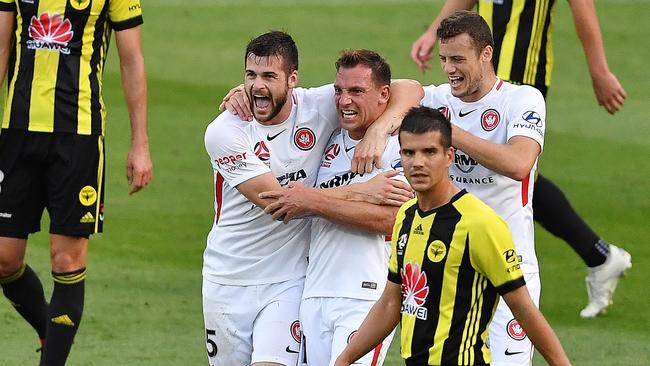 Brendan Hamill and Jerrad Tyson celebrate Brendan Santalab’s goal against Wellington.