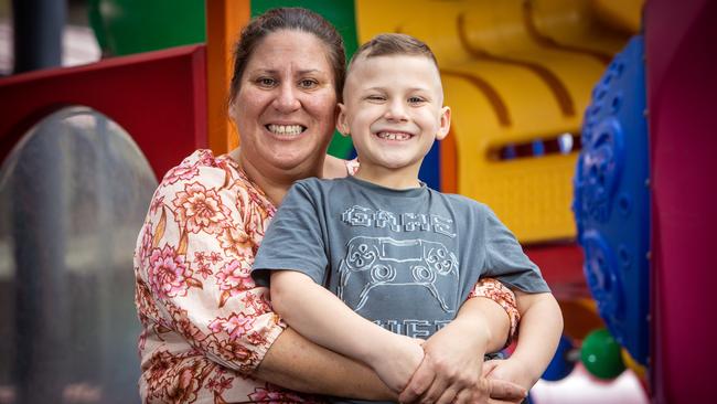 Eight-year-old Harrison Grey with his mother Paula Apostoles. Picture: Emma Brasier