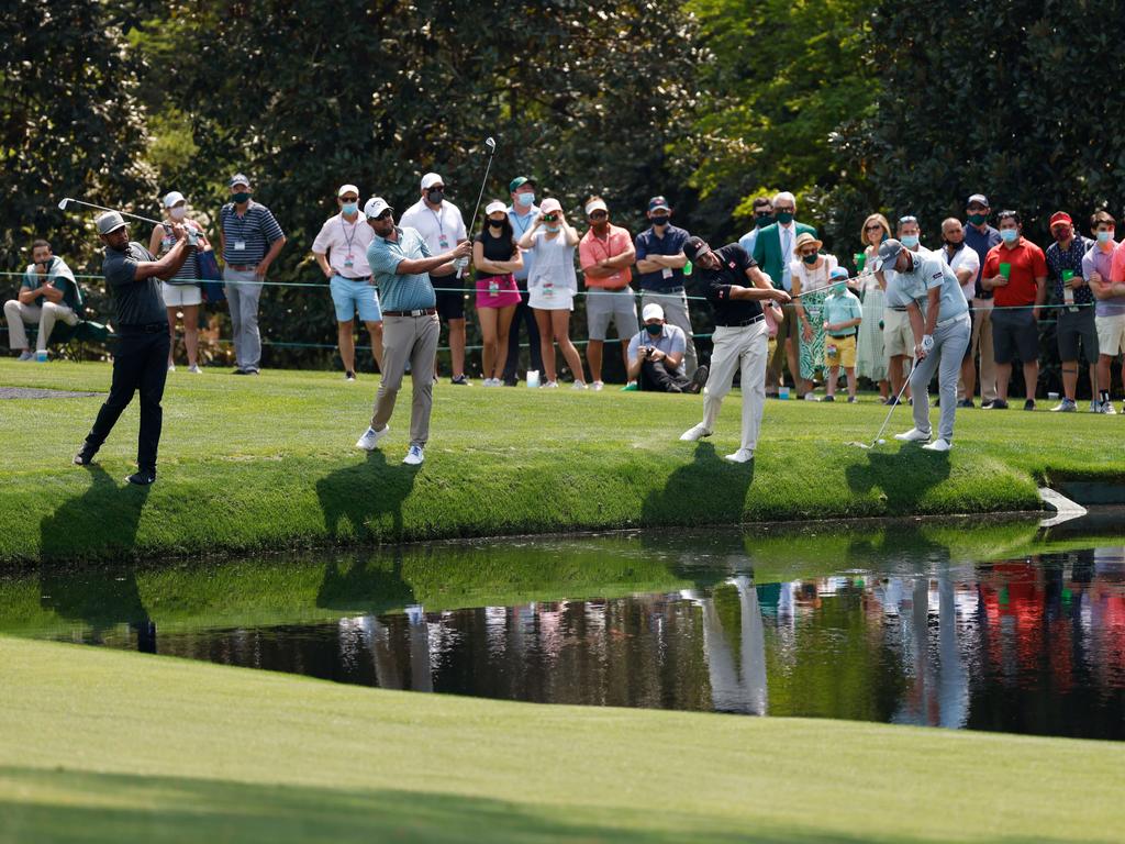 Aussies Marc Leishman, Adam Scott and Matt Jones practising on the 16th hole.