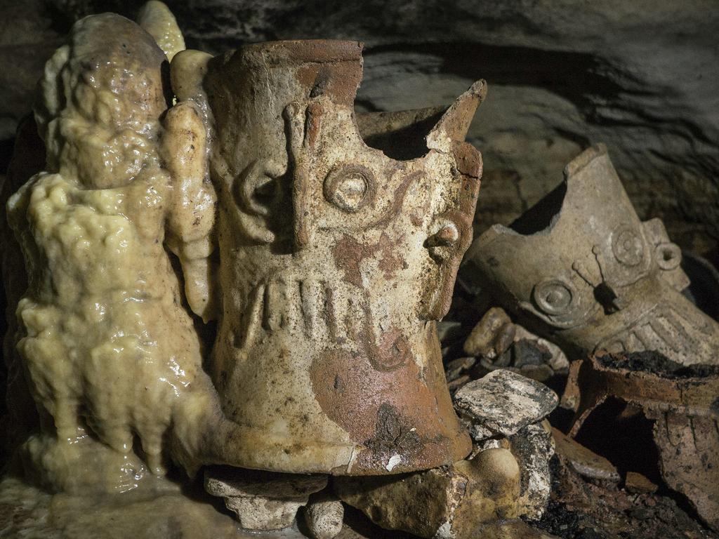 Mexican archaeologists say they have found a cave at the Mayan ruins of Chichen Itza with offerings of about 200 ceramic vessels in nearly untouched condition. Picture: Karla Ortega