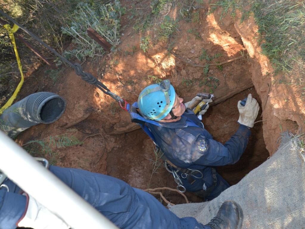 Police examine wells in Yatina, searching for evidence in the disappearance.