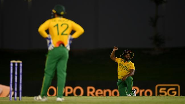 South Africa captain Temba Bavuma, pictured with de Kock behind the stumps, takes a knee before a warmup game against Pakistan ahead of the T20 World Cup. Picture: Getty