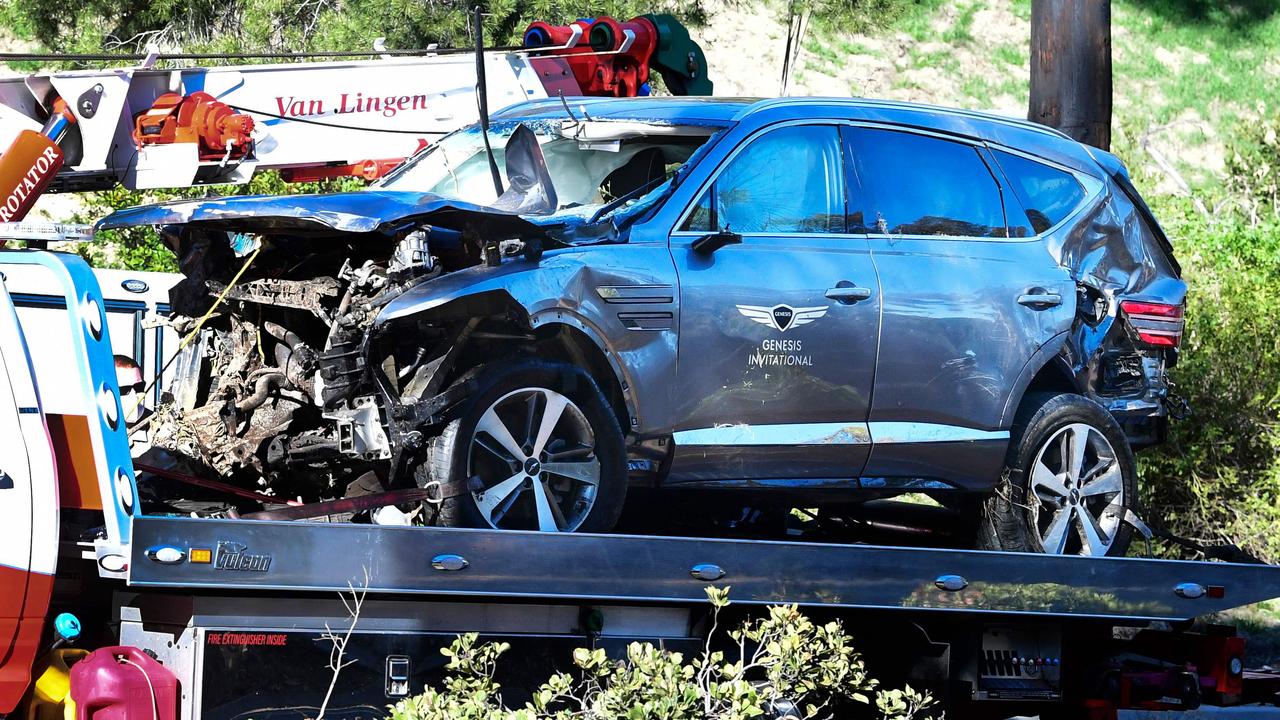 A tow truck recovers the vehicle driven by golfer Tiger Woods in Rancho Palos Verdes, California, on February 23, 2021, (Photo by Frederic J. BROWN / AFP)