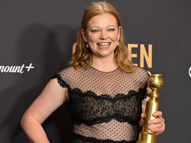 TOPSHOT - Australian actress Sarah Snook poses with the award for Best Performance by a Female Actor in a Television Series - Drama  for "Succession" in the press room during the 81st annual Golden Globe Awards at The Beverly Hilton hotel in Beverly Hills, California, on January 7, 2024. (Photo by Robyn BECK / AFP)