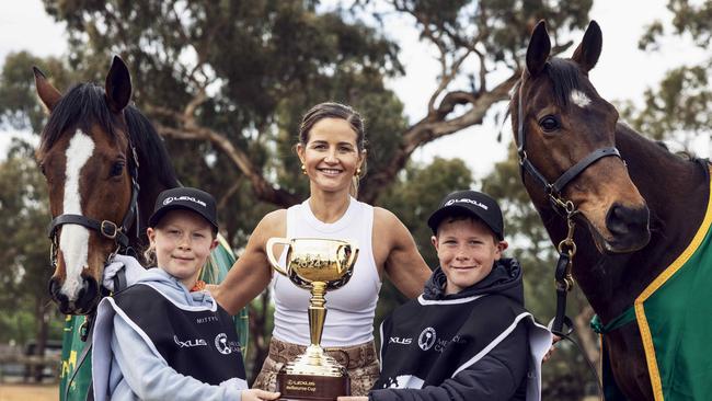 Michelle Payne with Rochester locals and Living Legends Twilight Payment and Prince of Penzance and this year’s trophy. Picture: Nicole Cleary