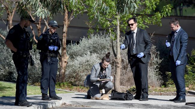 Police at the scene at Adelaide High School on West Terrace after a man was left in a critical condition after being assaulted by four men overnight. Picture: Naomi Jellicoe