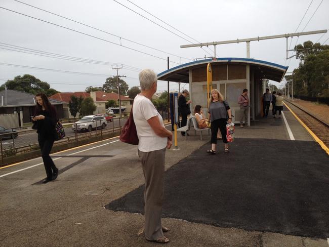 Stranded passengers wait for the Seaford train — which never came. Picture: Roger Wyman