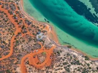 Aerial view of the coast along the Nullarbor Park, the great Australian Bight . in South Australia, Australia . Scenic outlook with campers , and boats .