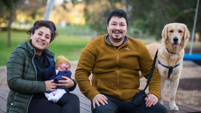 Inci and Tahsin Mazali with their 15-day-old baby Alpin and dog Lucy in Brimbank Park, Melbourne. Picture: Paul Jeffers