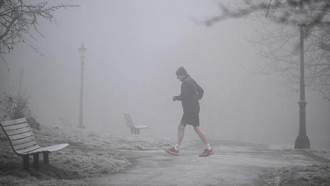 A jogger defies the frost at Primrose Hill in north London. Picture: AFP