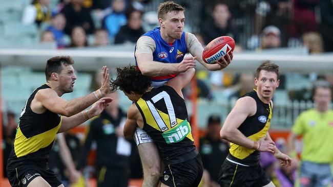 Daniel Rioli stops Jordan Roughead in his tracks. Picture: Michael Klein