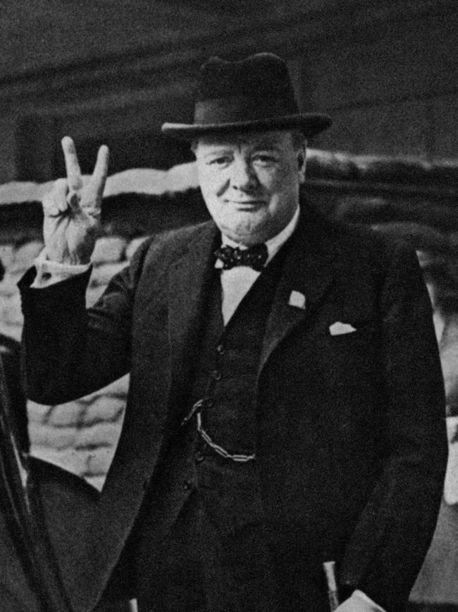 Winston Churchill flashes his famous V for victory sign in 1941.