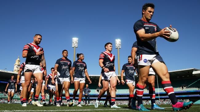 Cooper Cronk (right) missed the Roosters’ win over Penrith last weekend. Picture: Getty