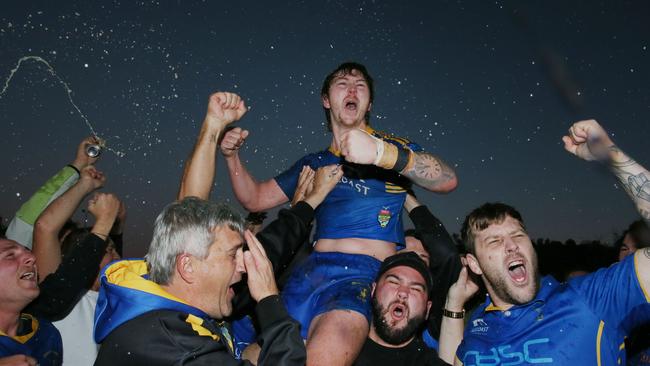 Toukley captain-coach Jake Fitzpatrick celebrates with fans after the Hawks defeated Erina 8-6 in the Central Coast Rugby League first grade grand final. Picture: Sue Graham