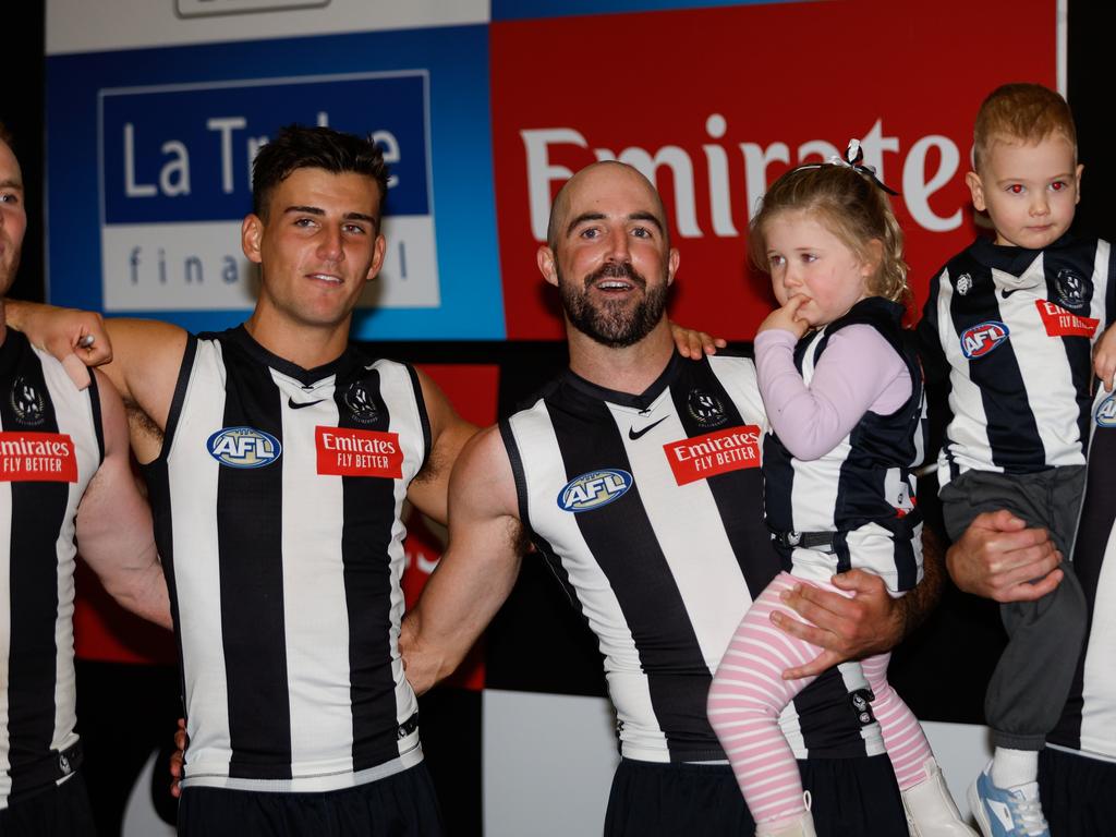 Nick Daicos and Steele Sidebottom during the Magpies’ team song. Picture: Dylan Burns/AFL Photos via Getty Images