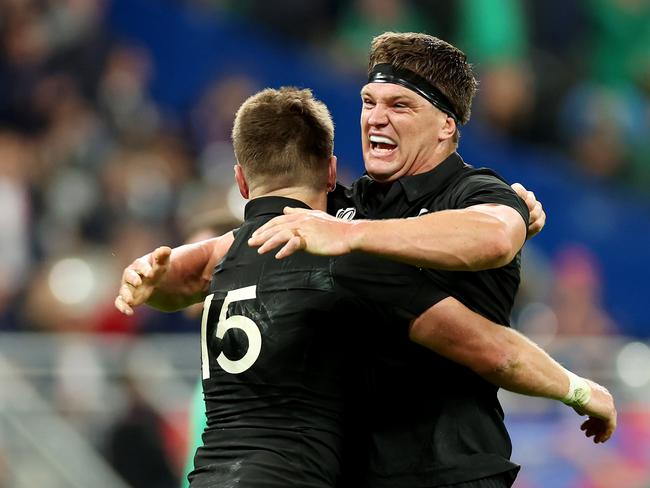 PARIS, FRANCE - OCTOBER 14: Beauden Barrett and Scott Barrett of New Zealand celebrate following the team's victory during the Rugby World Cup France 2023 Quarter Final match between Ireland and New Zealand at Stade de France on October 14, 2023 in Paris, France. (Photo by Chris Hyde/Getty Images)