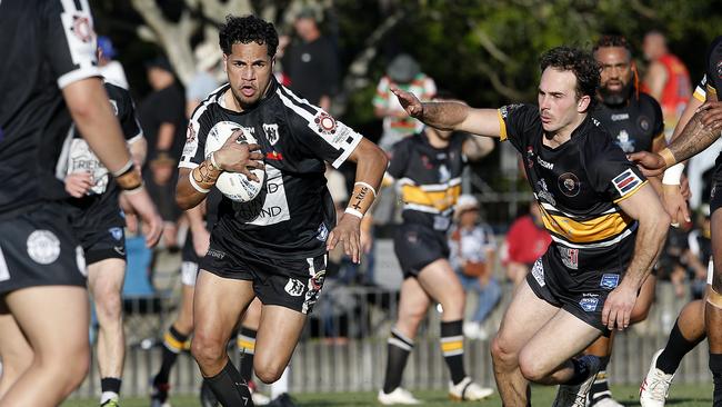 Redfern's Joven Gyemore takes on the line. Picture: John Appleyard