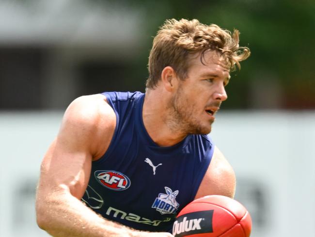 MELBOURNE, AUSTRALIA - DECEMBER 09: Luke Parker of the Kangaroos handballs during a North Melbourne Kangaroos AFL training session at Arden Street Ground on December 09, 2024 in Melbourne, Australia. (Photo by Quinn Rooney/Getty Images)