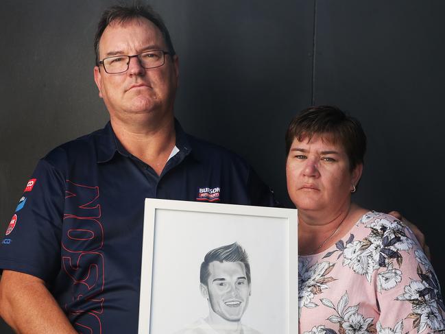 SUN TAS.  Gavin and Leanne Wakerell parents of Logan Braunack who died in a single vehicle accident.  They are holding a drawing of Logan done by a friend.  Picture: Nikki Davis-Jones