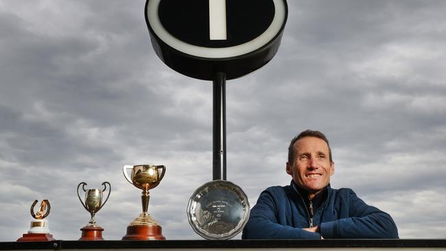 Champion jockey Damien Oliver with some of his trophies.