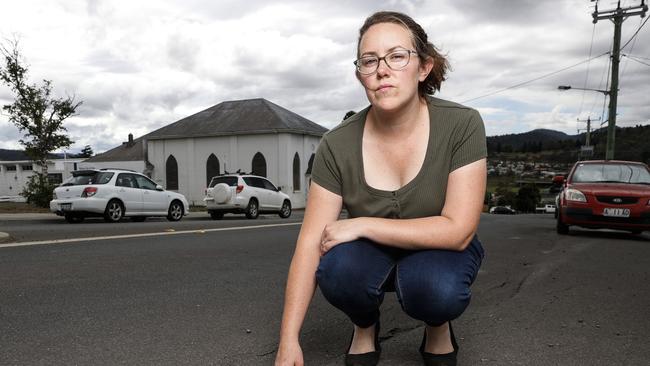 New Norfolk resident Tiffanie Palmer out the front of her Burnett Street home as she is concerned the road isn't safe after a burst water main damaged the road. Picture: Zak Simmonds