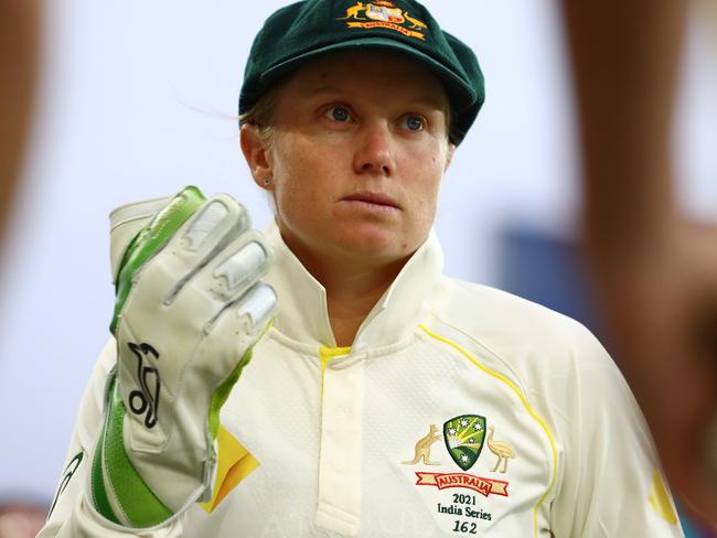 GOLD COAST, AUSTRALIA - SEPTEMBER 30: Alyssa Healy of Australia looks on during day one of the Women's International Test match between Australia and India at Metricon Stadium on September 30, 2021 in Gold Coast, Australia. (Photo by Chris Hyde/Getty Images)