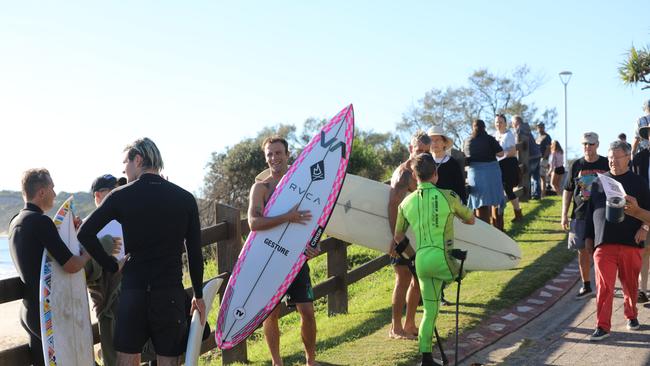 Members of the public took part in a paddle-out at Byron Bay's Main Beach to protest against the planned Netflix reality show Byron Baes on the morning of Tuesday, April 20, 2021. Picture: Liana Boss