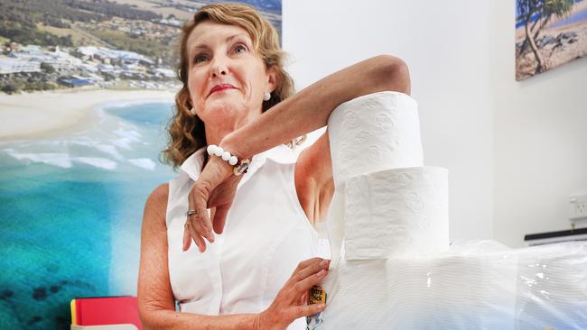 Kingscliff Real Estate agent Heather Stewardson is offering free toilet paper with every listing. Photo: SCOTT POWICK