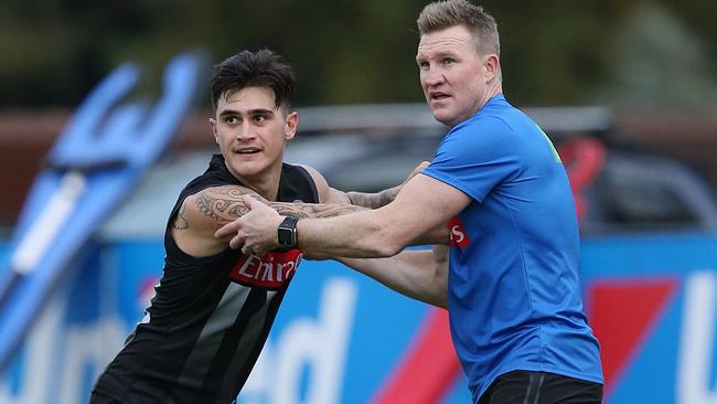 Marley Williams works with coach Nathan Buckley at training this week ahead of his senior return from injury. Picture: Wayne Ludbey