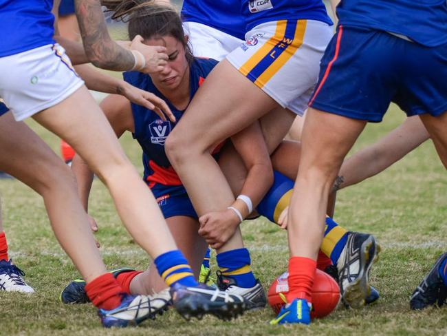 Chloe Molloy finds herself at the bottom of a pack for Diamond Creek in the VFL Women's competition. Picture: Russ Cunham