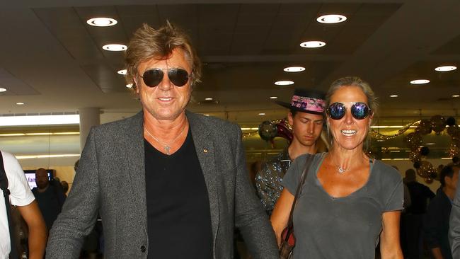 Richard Wilkins arrives in Sydney after the Stefanovic wedding, with his partner Virginia Burmeister and son Christian Wilkins. Picture: Matrix