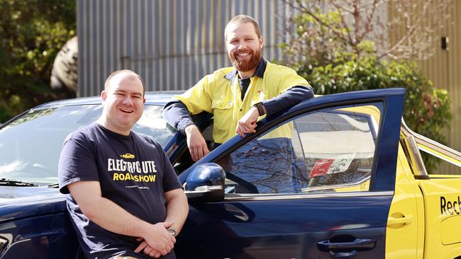 Ben Lever from Solar Citizens and electrician Jacob Kennedy said one of the benefits of an electric ute is the low ownership costs. Picture: Tim Hunter.