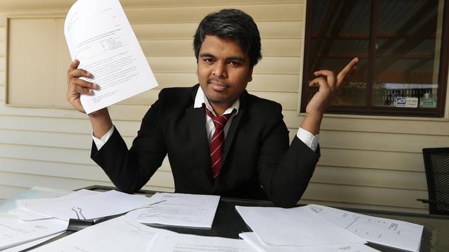 Mr Naik with court documents at his Oakleigh South home. Picture: Alex Coppel