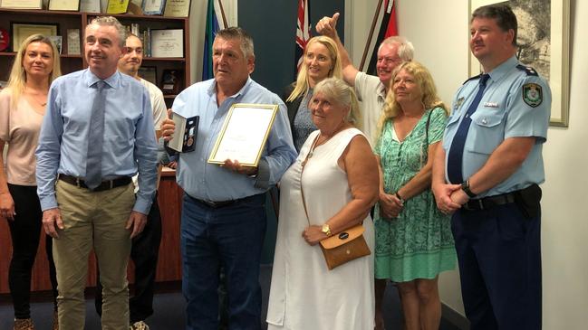 BRAVEHEART: Kevin Dowd's selfless act in rescuing a burning man from his car shortly before it exploded was recognised with a Royal Humane Society of NSW Bronze Medal Bravery Award presented by Federal Member for Page Kevin Hogan. Richmond Police District Commander Superintendent Scott Tanner presented Mr Dowd with a commendation in front of family and friends. Photo: Alison Paterson