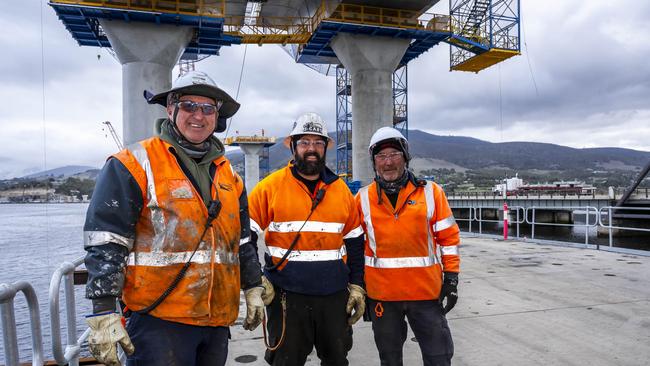 New Bridgewater Bridge under construction. Brian Walker, rigger and operator, Jaimon Roberts, labourer, and John Dennehy, foreman. Picture: Caroline Tan