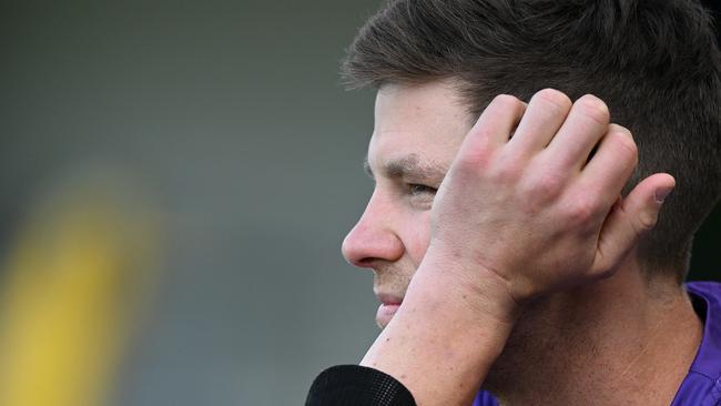 Tim Paine waits to bat during his BBL return.