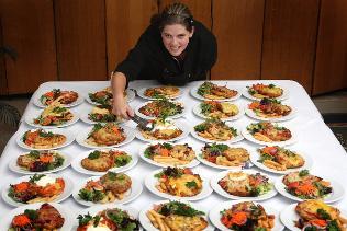 <strong>Top 30:</strong> Cook Jaimee Sheridan with the Commercial Hotel's parmas. Picture: Andrew Tauber