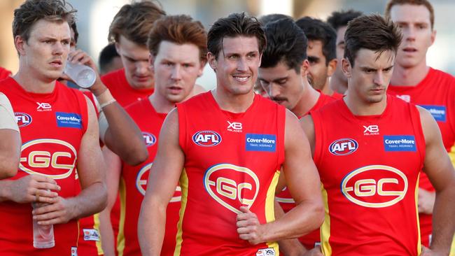 David Swallow leads the Suns off after losing to the Bulldogs.