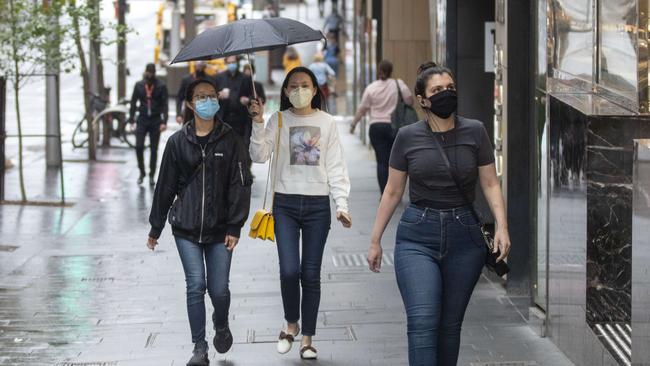 Those who did head out took precautions, including these shoppers on Market Street. Picture: NCA NewsWire/Jenny Evans