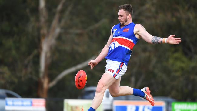 Justin Van Unen takes a kick for Wandin. Picture: James Ross