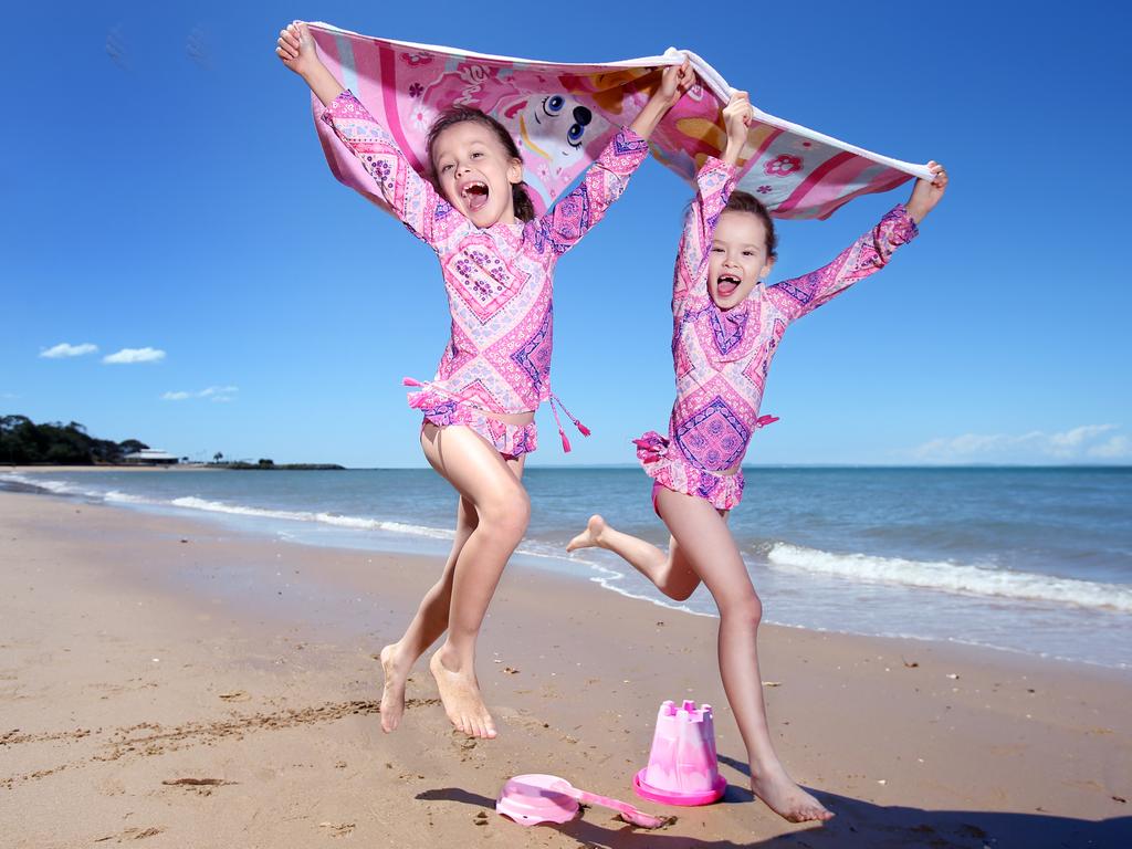 Twins Heidi (left) and Elisha, 7, at Suttons Beach north of Brisbane. Picture: Steve Pohlner