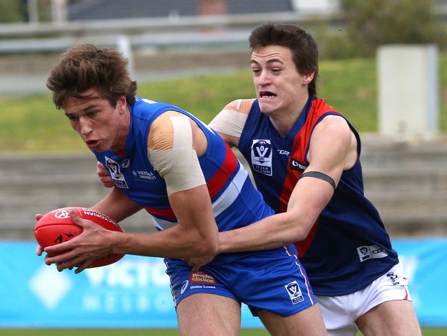 Nathan Mullenger-McHugh of Footscray is tackled by Cameron Holdsworth of Coburg during the VFL match between Footscray and Coburg played at Whitten Oval on Saturday, July 22, 2017, in Footscray, Victoria, Australia. Picture: Hamish Blair